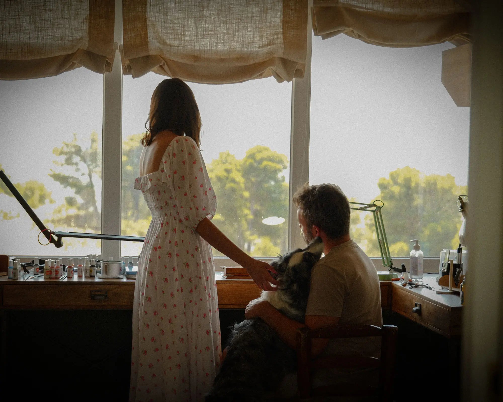 Lucas and Irene looking out of their studio window